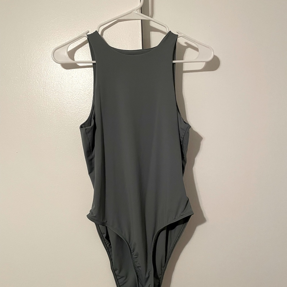 Olive green body suit. Cute, comfy, and stretchy size small bodysuit.